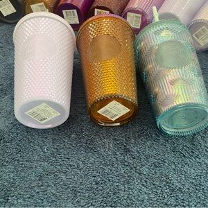 Starbucks Tumbler Set - Pink, Gold, Iridescent. $10 each.